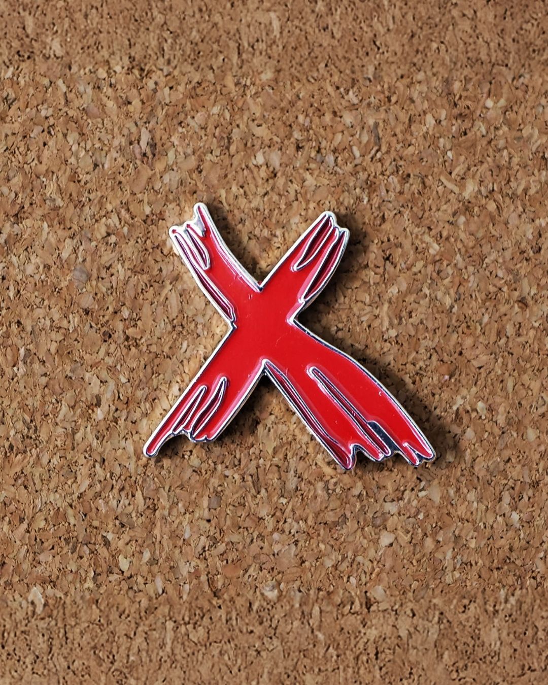 Le Pin's Xsite